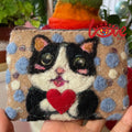 A cat with a sweet heart (dots)