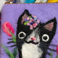 A cat with tulips