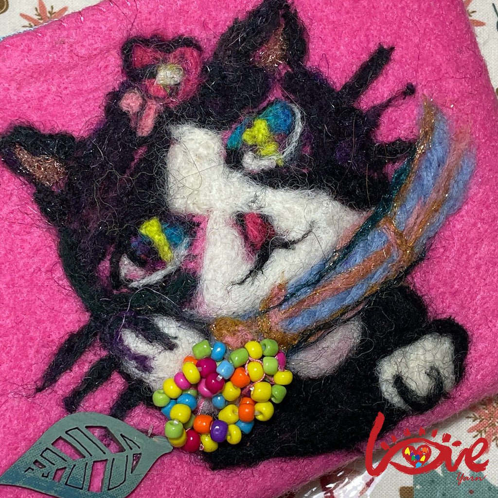 Oreo with scarf and colorful leaf