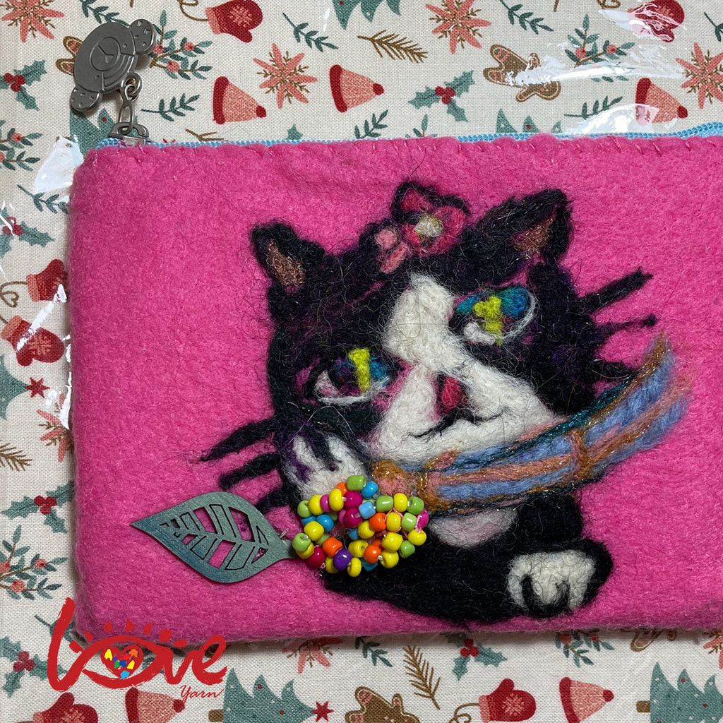 Oreo with scarf and colorful leaf