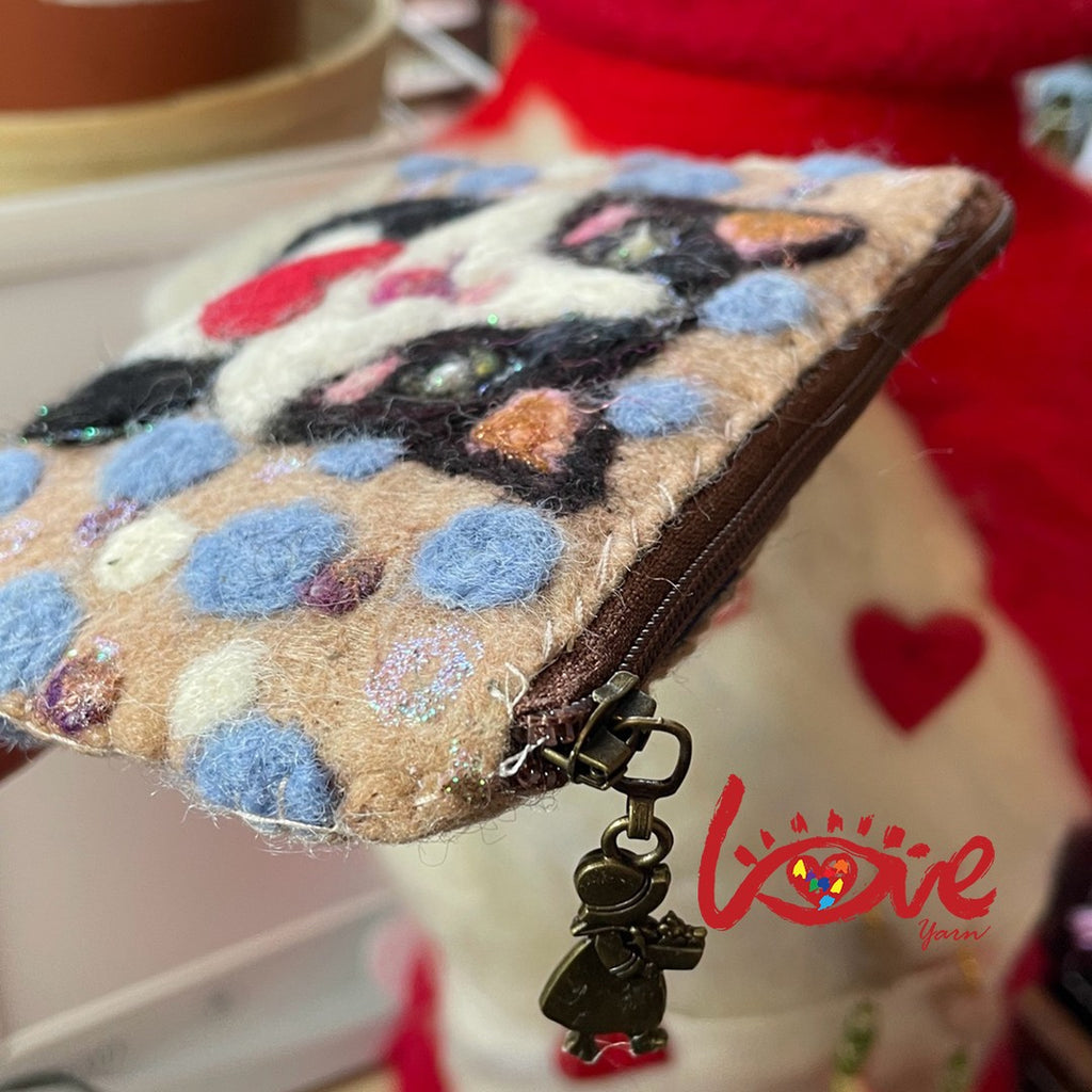 A cat with a sweet heart (dots)