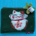 Lucky cat with a pink flower