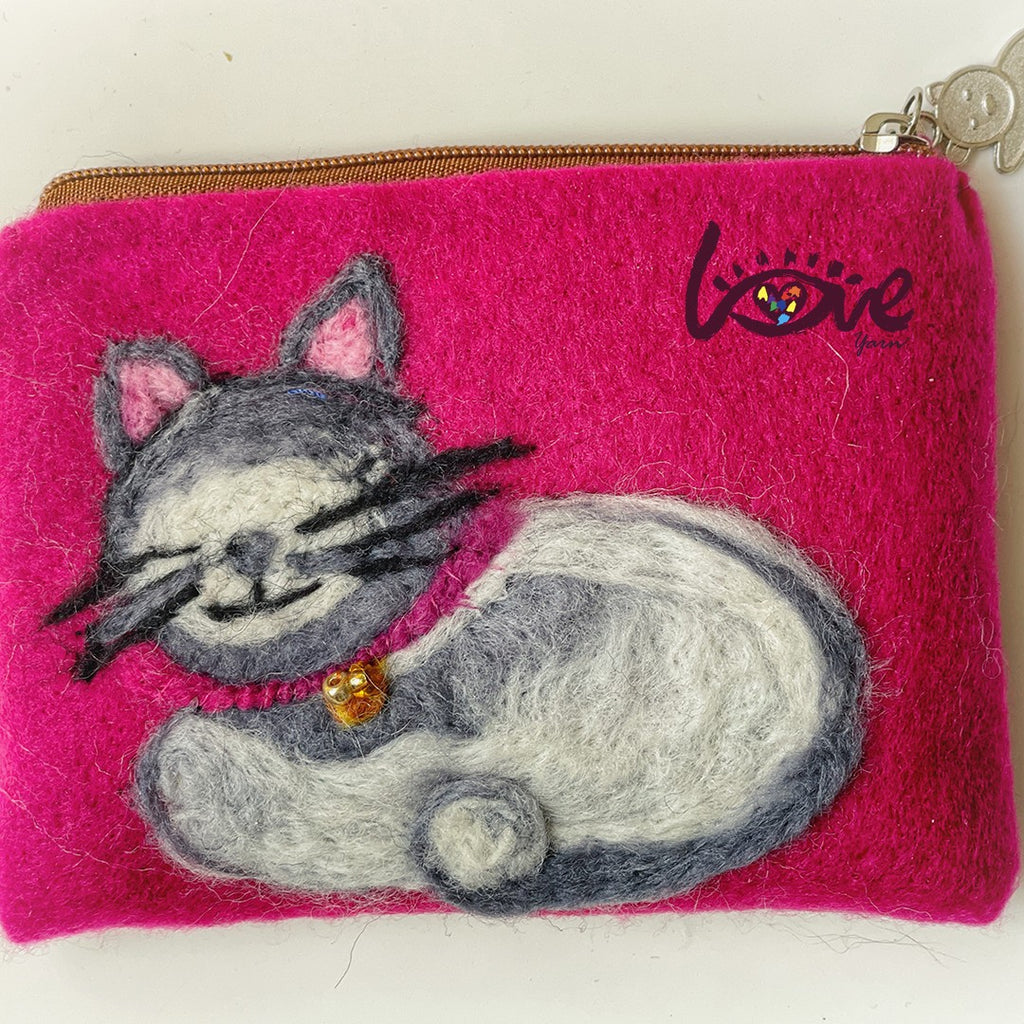 Oreo with a gold cat bell